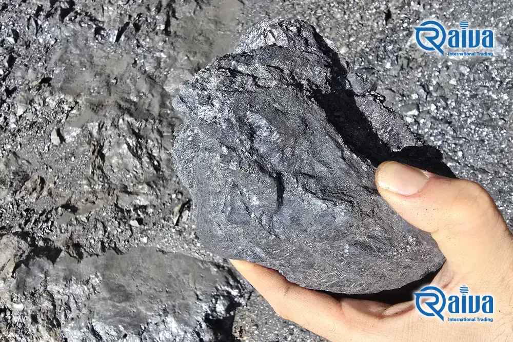 Lustrous anthracite coal lump held at the mine face &mdash; 83.9% fixed carbon &mdash; B2B bulk export supplier &mdash; Raivaco